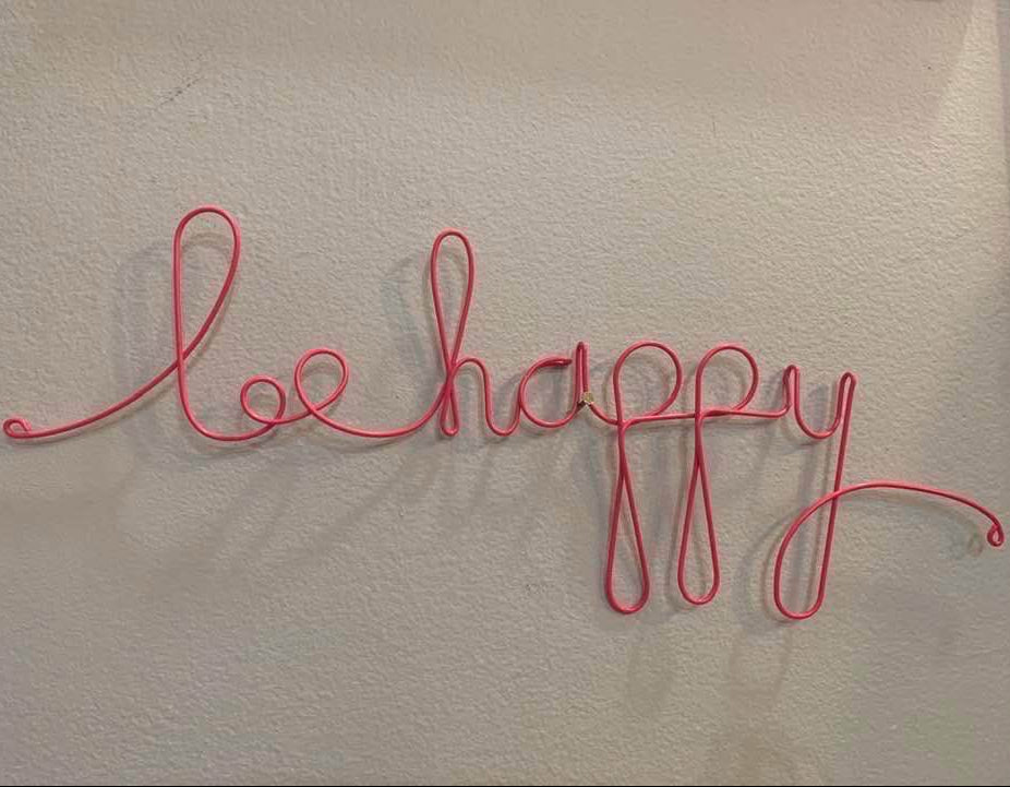 Pink 'Be Happy' Sign